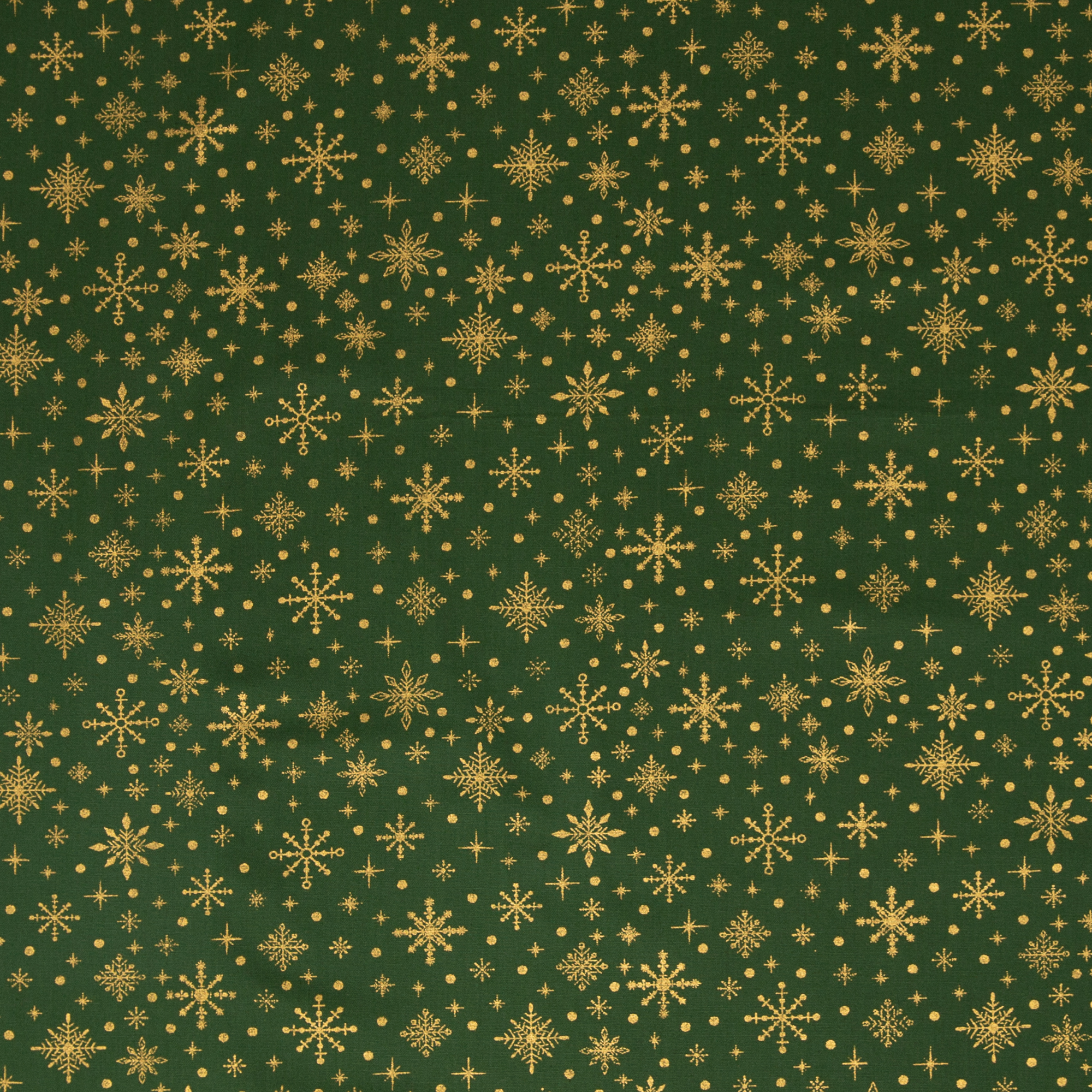 Bavlněné plátno - Zlaté vločky na zelené